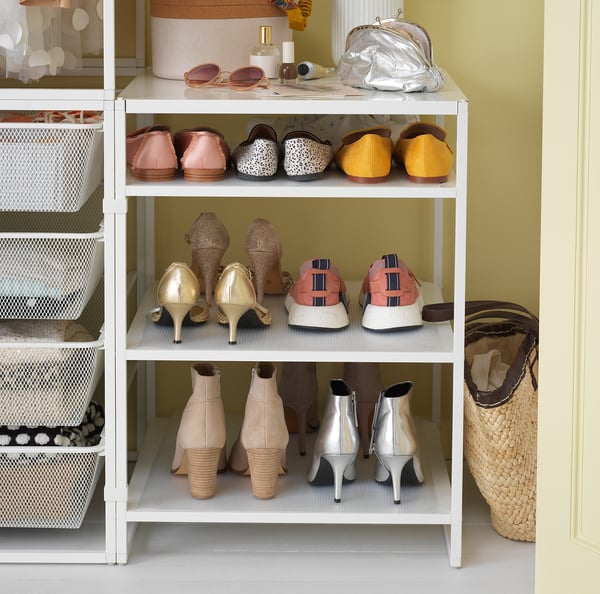 Organised shoe rack with colourful heels and flats, including gold and metallic styles.