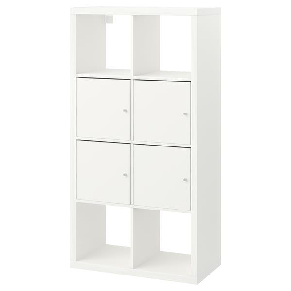 Displays a white ikea KALLAX storage unit, featuring open and closed compartments with a minimalist design, suitable for organizing items.