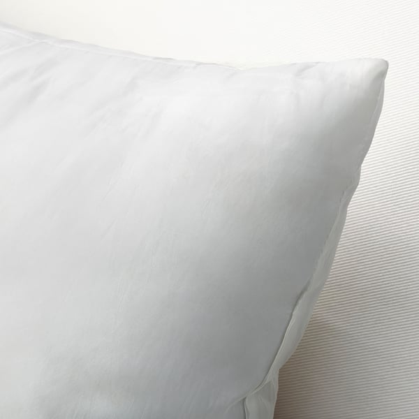 Plush, plump pillow with smooth, woven fabric texture, highlighting its luxurious, supportive quality.