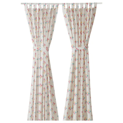 KLIBBARV curtains: white with multicolor star patterns, cotton, rectangular, tied back.
