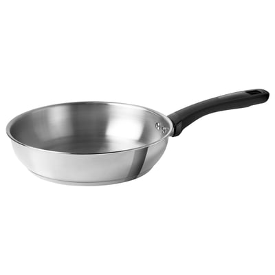 A KLIPPBROSME frying pan in silver with a black handle, made of stainless steel, designed for durability and versatile cooking.
