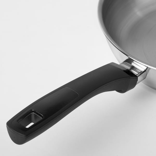 Stainless steel frying pan with black phenolic handle, designed for durability and even heat distribution.