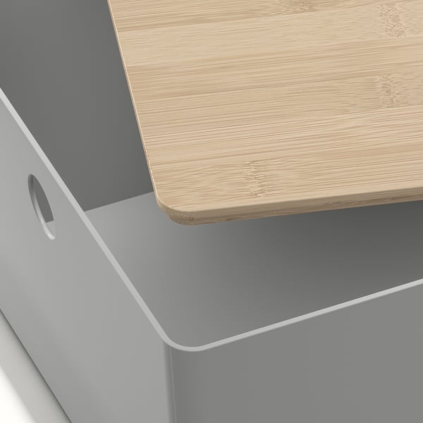 Close-up of white storage box with wooden lid, showcasing quality materials and design.