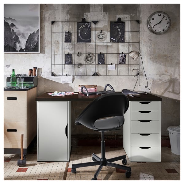 Industrial-style home office with LAGKAPTEN desk in white and wooden top, black swivel chair,mosaic-tiled floor.