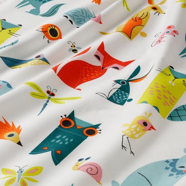 Colourful owl fabric, detailed, vibrant, on soft cotton.