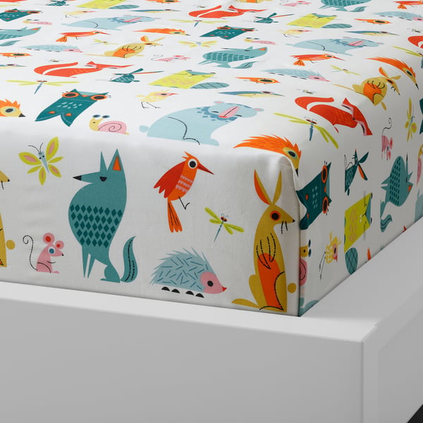 Brightly coloured bedspread with animal patterns. Owls, birds, foxes, and other animals. Woven cotton, feels smooth and durable.
