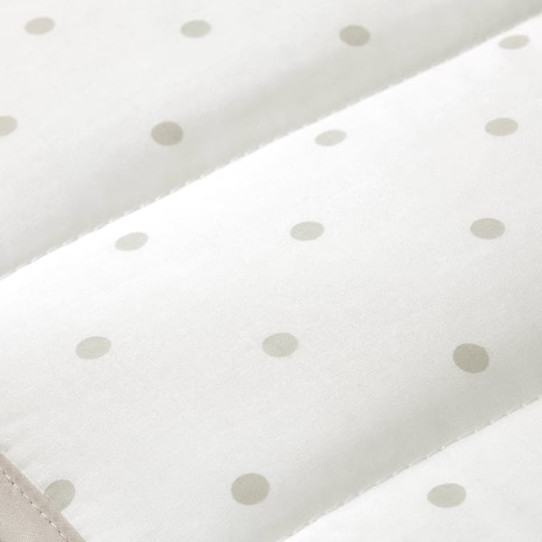 White cotton fabric with evenly spaced light grey dots, neatly folded, showing high quality and precision in stitching.
