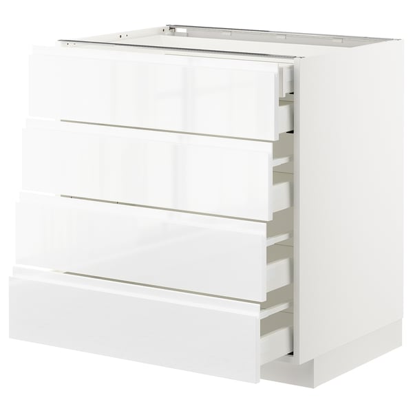 Modern white high-gloss kitchen cabinet with integrated handles and smooth-closing drawers.