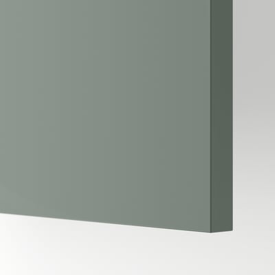 Close-up of METOD kitchen cabinet with sleek, matte grey-green finish. Smooth, modern surface showcasing high quality.