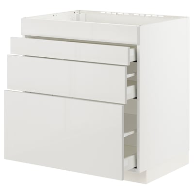 Modern white kitchen cabinet with four pull-out drawers.