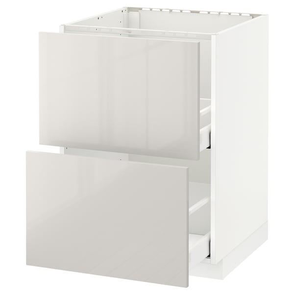 White modern METOD kitchen cabinet with glossy drawers, sleek and clean design.