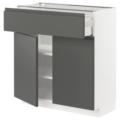 Modern dark grey kitchen unit with smooth drawer and adjustable shelves.