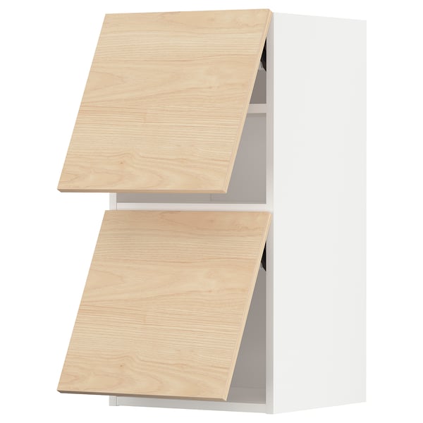 Wooden kitchen cabinet doors in light ash colour, slightly angled, displayed against white background.