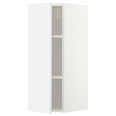 A white, modern corner cabinet. It has three shelves and a sleek, high-gloss finish. The cabinet is part of the METOD kitchen system.