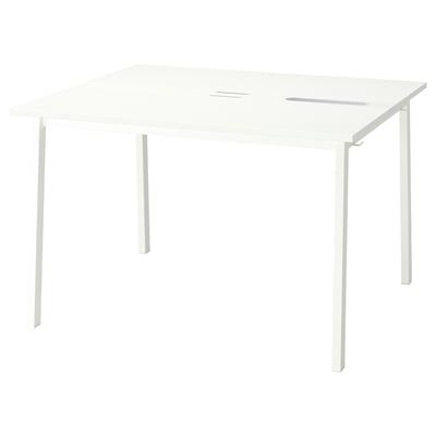 A white MITTZON conference table, rectangular in shape, with a smooth finish and four metal legs. Its designed for business use and cable management.