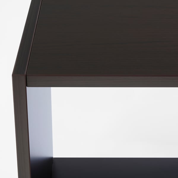 Modern bedside table with sleek, dark finish; sturdy, minimalist design; perfect for small spaces.