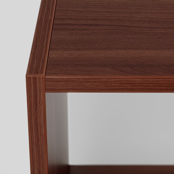 Close-up of sleek, dark wood bedside table with clean lines, showcasing quality finish and sturdy build.