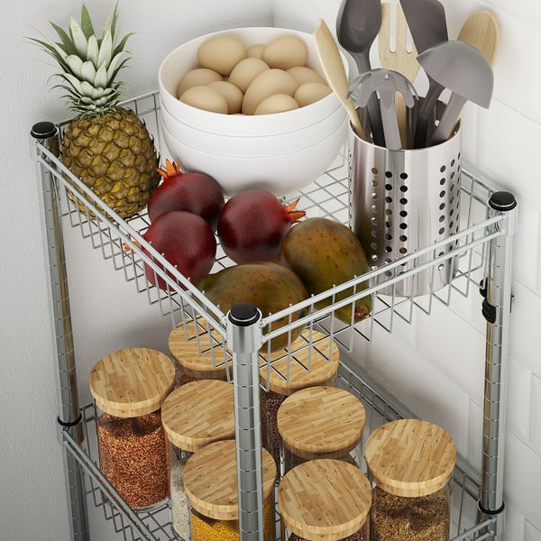 Kitchen shelf displaying fruits, bowls, and wooden cutting boards, organising items neatly.