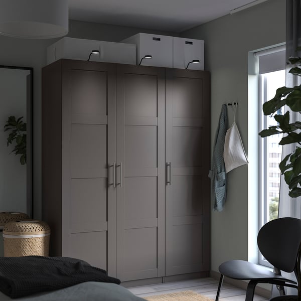 Modern grey PAX wardrobe two doors, two white boxes on top, and soft closing hinges.