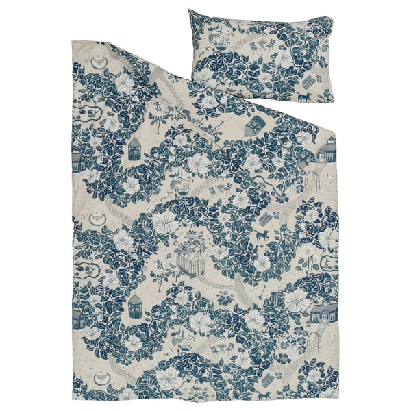 A blue “PJÄXE” duvet cover set with a floral design, laid flat. The material is 50% cotton, 50% lyocell.