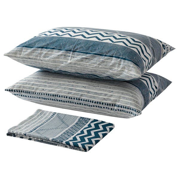 A set of blue and white patterned bed linens, including pillows and fitted sheets, all made of cotton.
