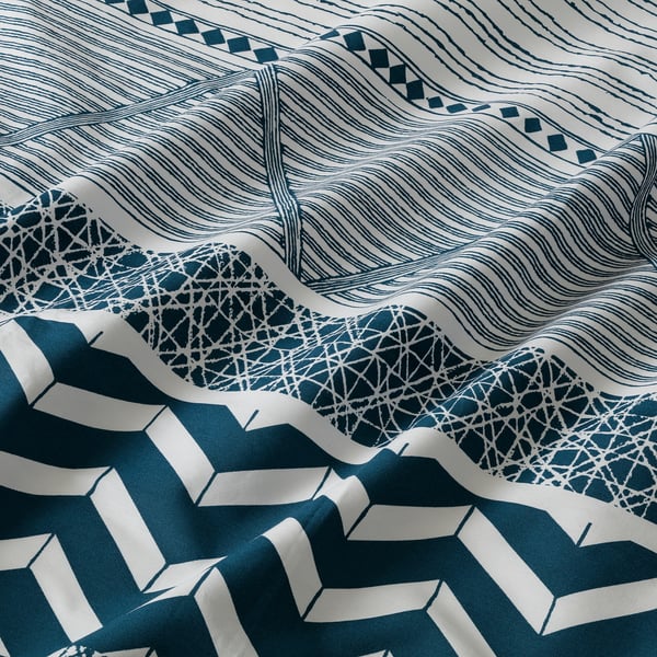 Blue & white geometric bedding, soft, detailed craftsmanship.