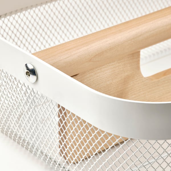 A close-up of a metal mesh storage basket with a wooden divider. The basket has a smooth, white finish and a sturdy handle.