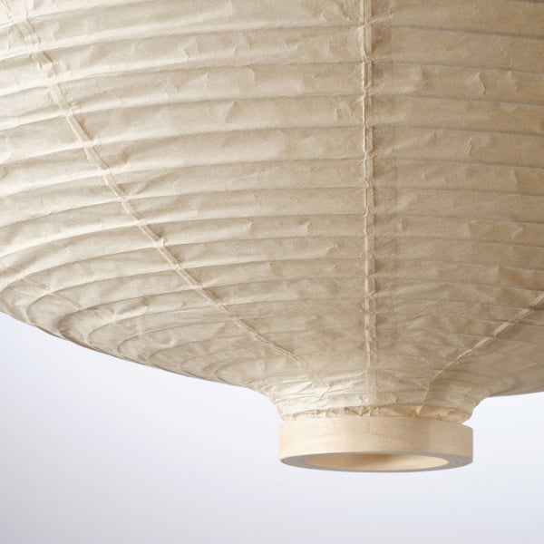 Close-up of a natural, stylish lamp with double-layered rice paper, casting soft, even light.