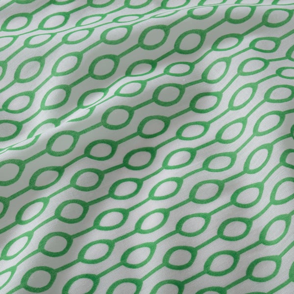 Close-up of green geometric print on white fabric. Smooth, even pattern suggests quality textile.