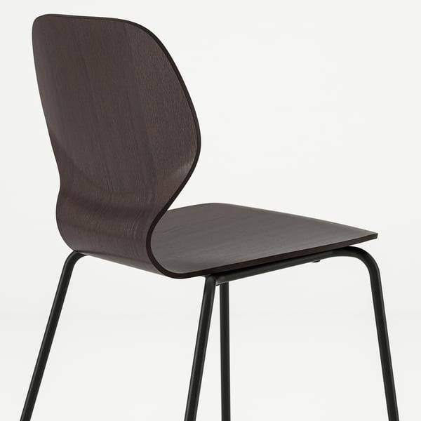 Dark wood chair with sleek design and metal legs. Sturdy build, curved back for comfort.