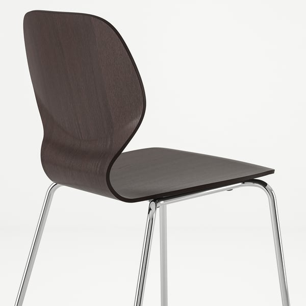 Black wooden chair with chrome legs; stylish and modern design.