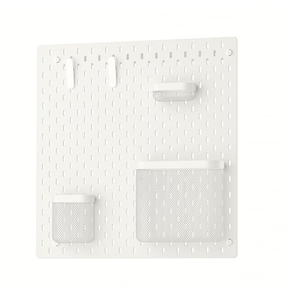 White SKÅDIS pegboard with mesh baskets and hooks for wall organisation.