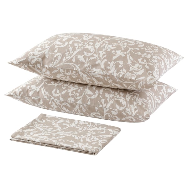 A beige SORGMAL bedsheet set with leafy white patterns, including two pillowcases and a folded sheet, all made of 100% cotton.