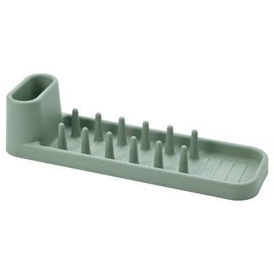 A green STÄMLING dish drainer made of recycled plastic, featuring multiple prongs for drying dishes and cutlery, with a modern, rectangular shape.