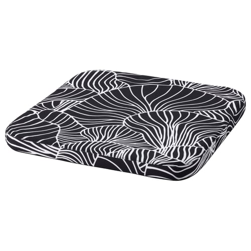 Black-white patterned seat cushion, rectangular with cartoonish wavy lines, soft foam filling, zippered cover.