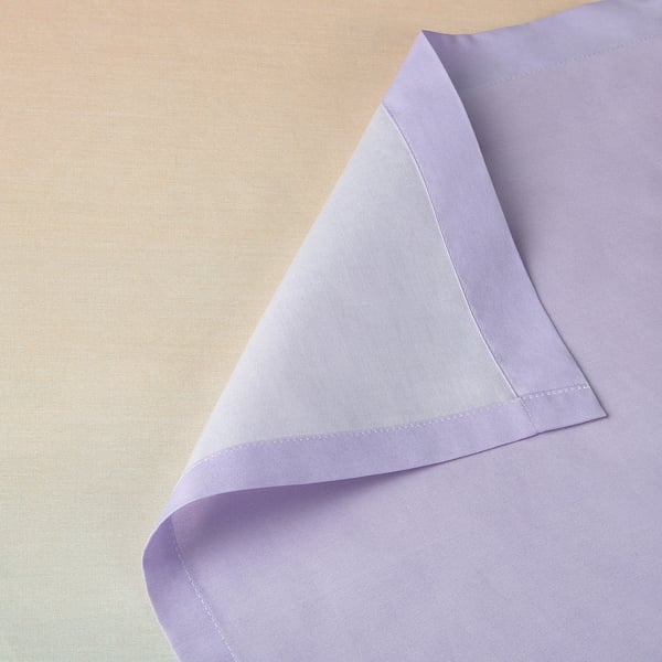 Folded lavender fabric close-up; smooth texture, sharp hemmed edges visible.
