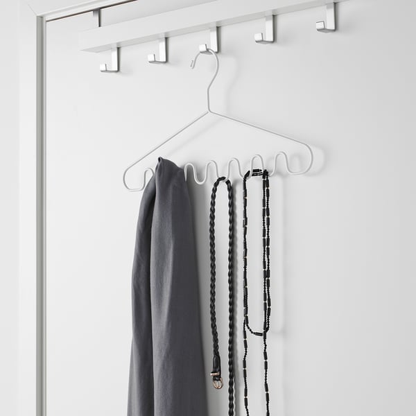 White multi-hook hanger holding grey cloth and hanging accessories. Space-saving organisation for shawls, belts, ties, and accessories.