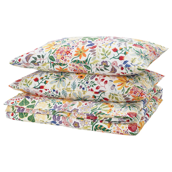 STRANDLUMMER bedding: vibrant floral design, white base, cotton material, square pillows & folded duvet, colourful & detailed print.