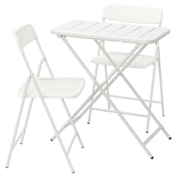 White TORPARÖ outdoor set: foldable, durable, easy-care, drained design, comfortable chairs.