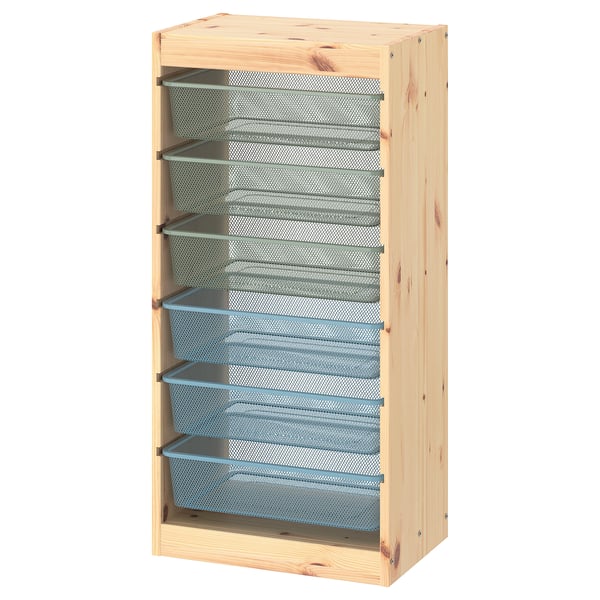 A wooden TROFAST storage unit with blue mesh drawers, ideal for teens.