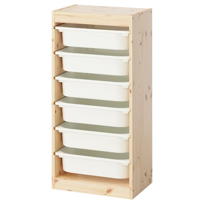 An ikea TROFAST storage unit in light pine with six white plastic bins for organizing childrens toys.