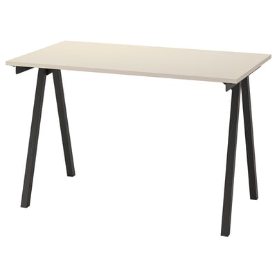 A TROTTEN desk in beige with black metal legs in an a-shape.