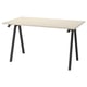 A TROTTEN desk with a beige top and black metal legs.