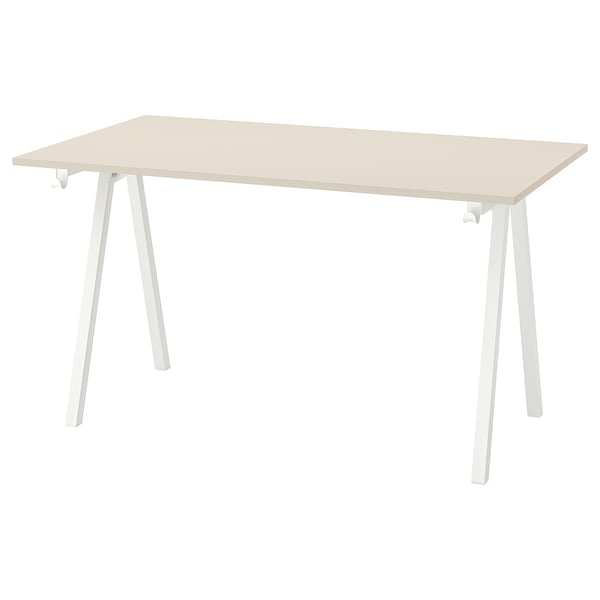 A TROTTEN desk with light beige top and white, a-shaped legs. Its simple and sturdy for various spaces.