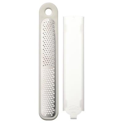UPPFYLLD handheld grater, white, plastic protector, stainless steel grater, rectangular shape, compact design.