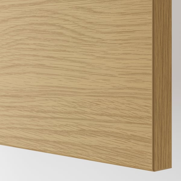 Close-up of oak-finished wood panel, smooth surface, uniform grain.