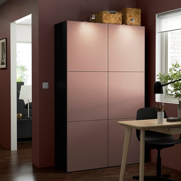Modern living room with BESTÅ cabinet in pale pink. Blends style and functionality.