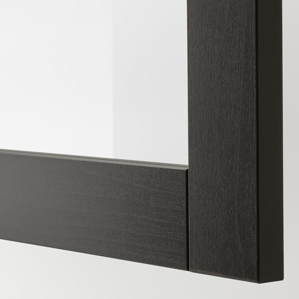 Close-up of sleek, modern black framed mirror, showcasing quality craftsmanship, precise edges, and reflective surface.