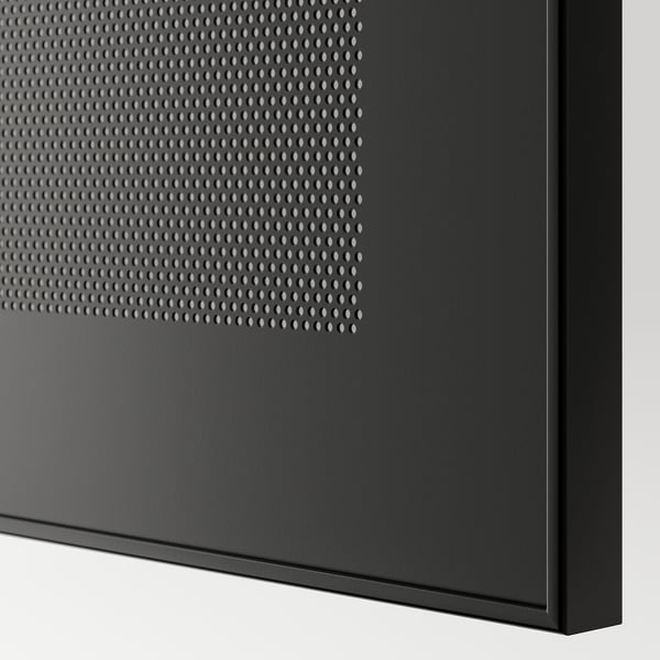 Black tv stand, close-up with perforated metal, high-quality design.