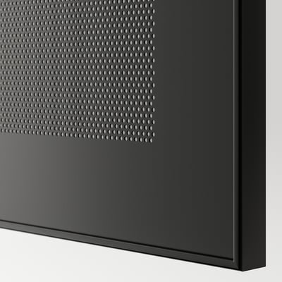 Close-up of sleek, modern furniture panel with dot-pattern vent, smooth edges.